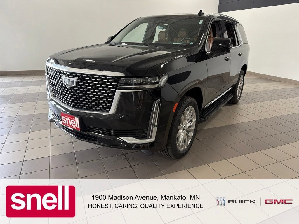 2021 Cadillac Escalade Premium Luxury in Black Raven — front three-quarter view