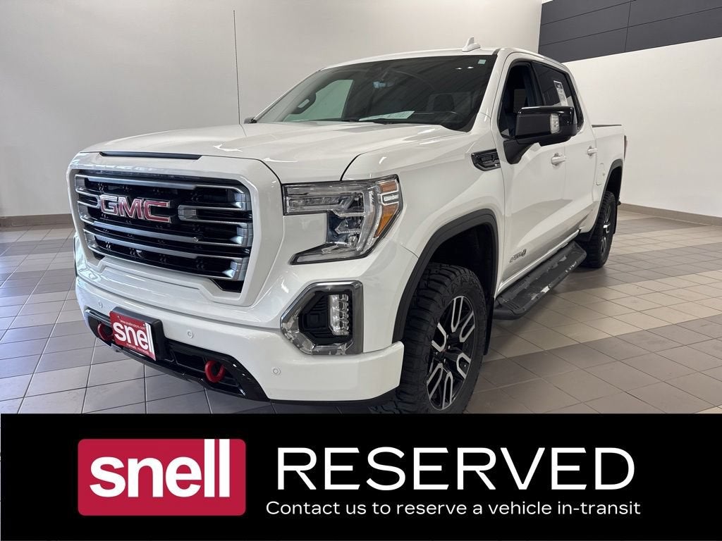 2021 GMC Sierra 1500 AT4 in Summit White — front three-quarter view