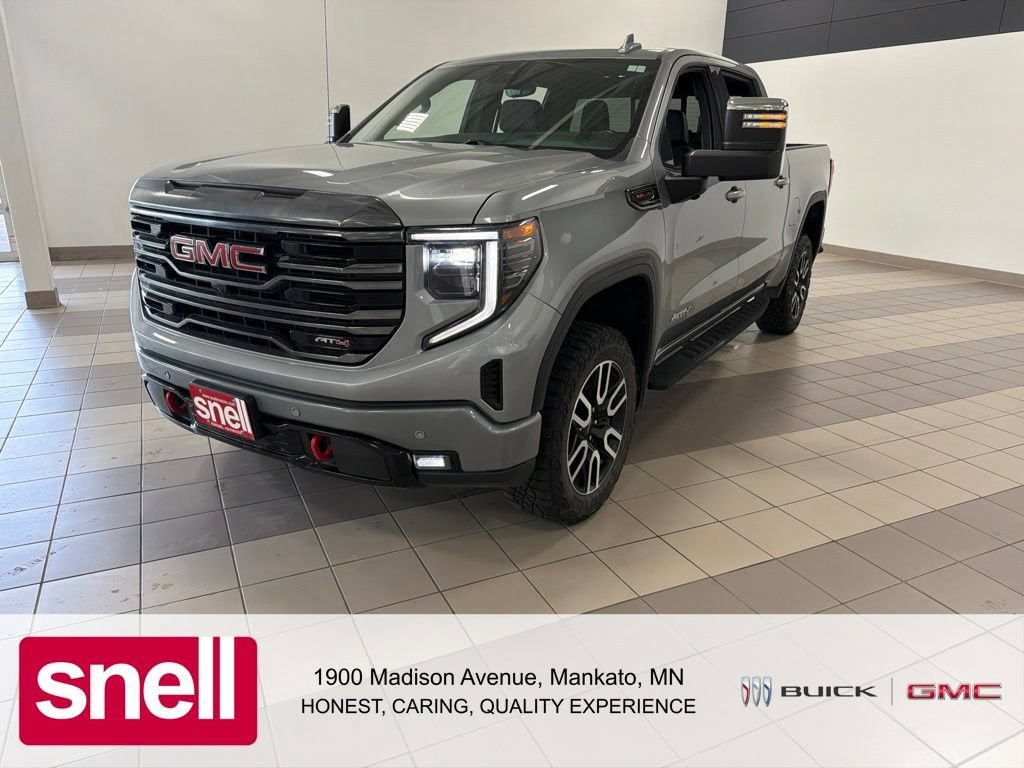 2024 GMC Sierra 1500 AT4 in Sterling Metallic — front three-quarter view